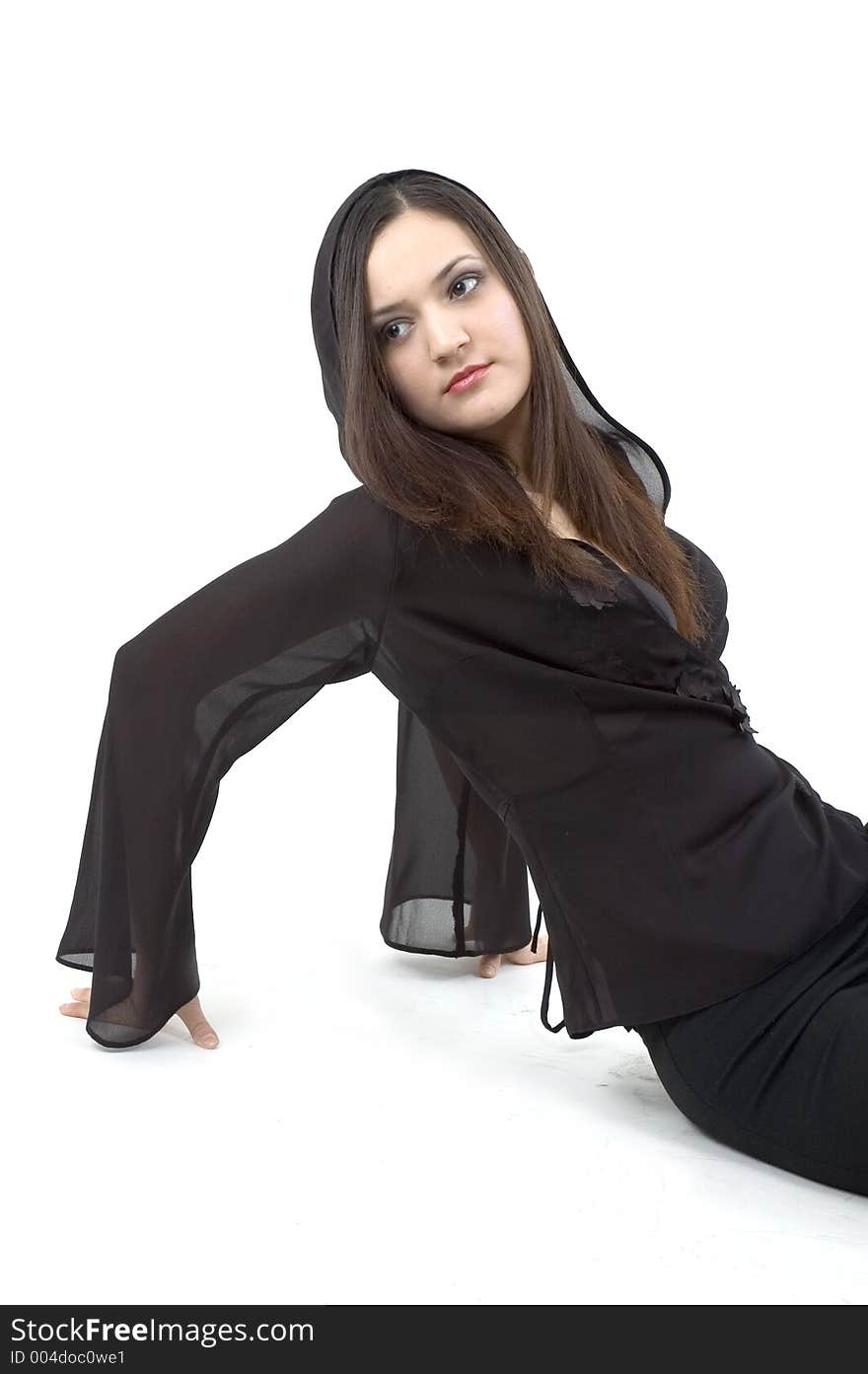 Young woman in a laid back pose, wearing a black outfit. Young woman in a laid back pose, wearing a black outfit.