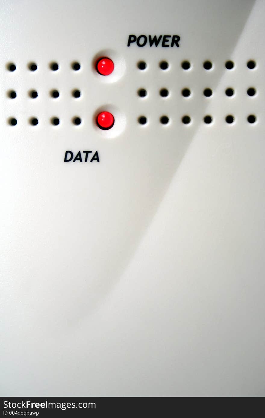 Lights on a modem indicated by power and data with ventilation holes. Lights on a modem indicated by power and data with ventilation holes