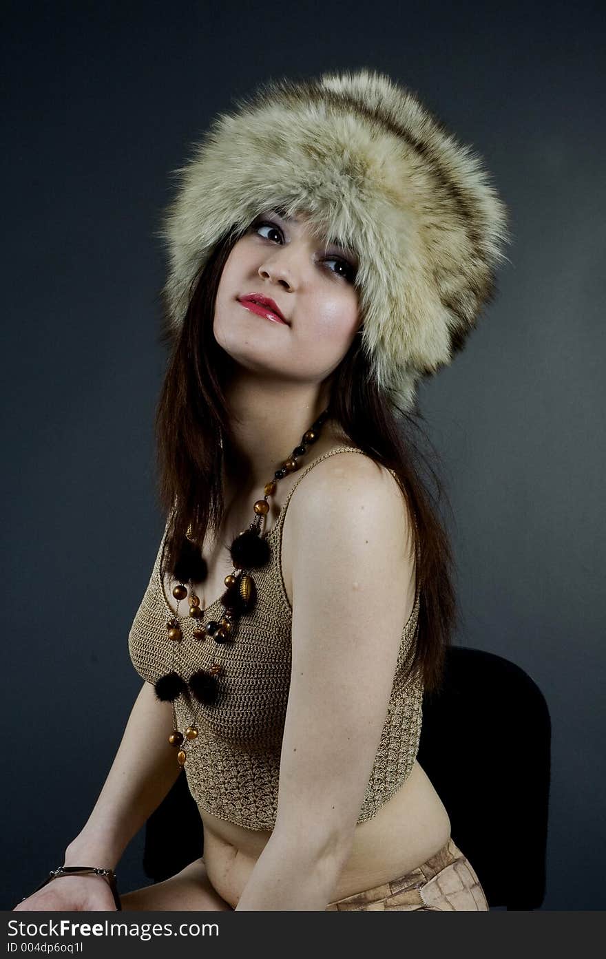 Young woman in big fur russian hat. Young woman in big fur russian hat