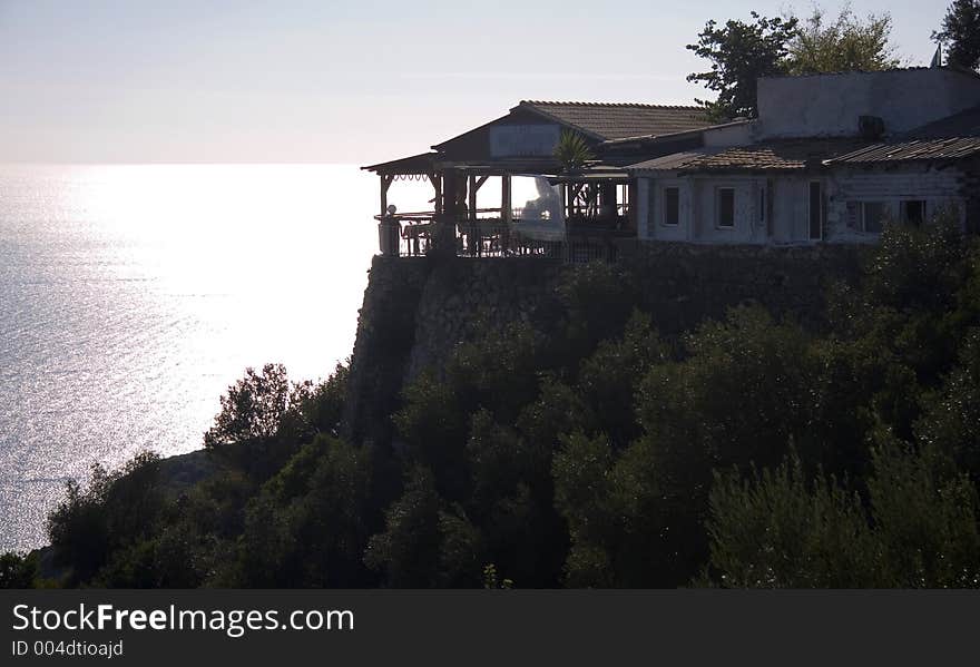 Silhouette at sunset of a Greek taverna. Silhouette at sunset of a Greek taverna