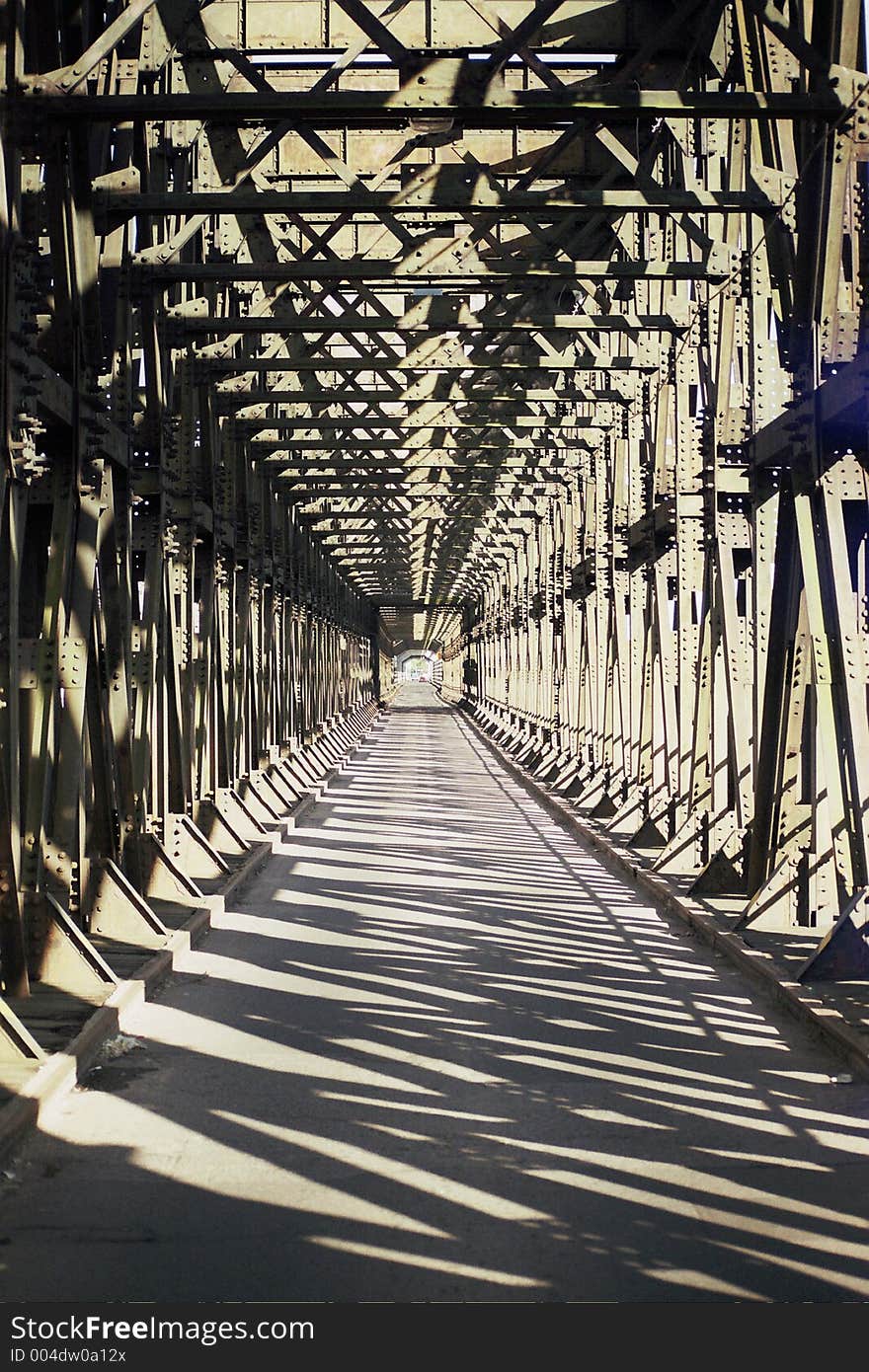 The architecture of a long iron bridge, over the Vistula river in North Poland. The architecture of a long iron bridge, over the Vistula river in North Poland.