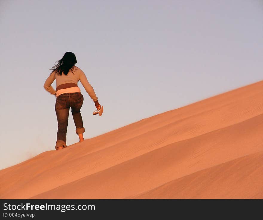 Girl Walking over Dunes. Girl Walking over Dunes