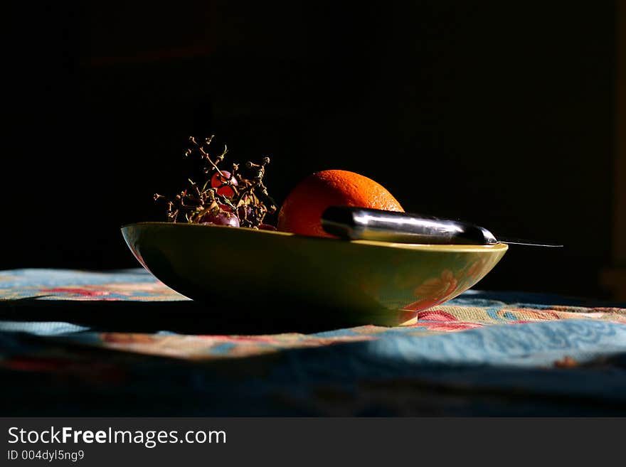 Bowl of fruit with paring knife