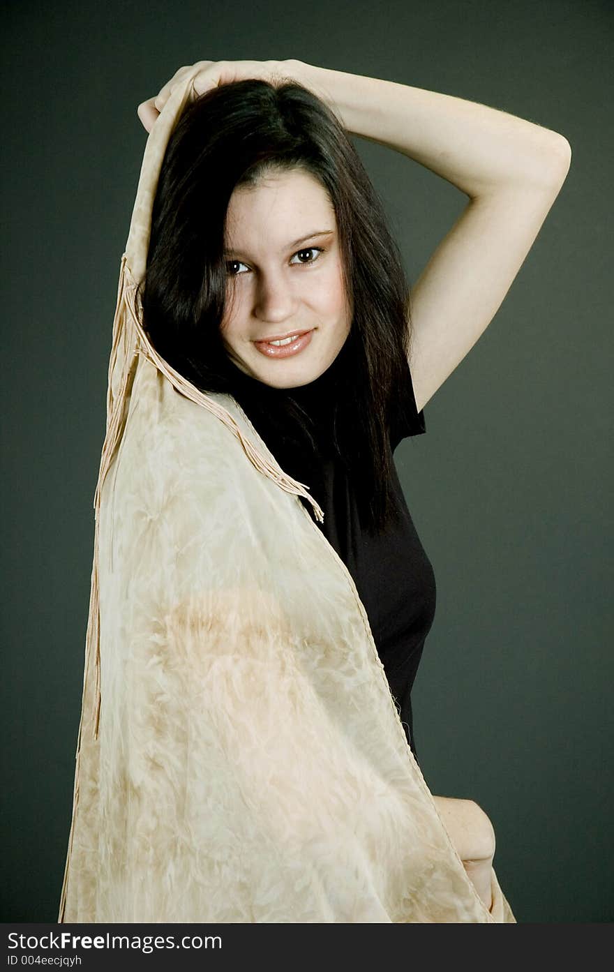 Young woman with silk beige scarf. Young woman with silk beige scarf