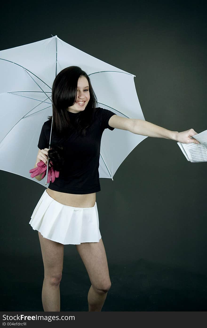 Young woman handing out some papers under a big white umbrella. Young woman handing out some papers under a big white umbrella