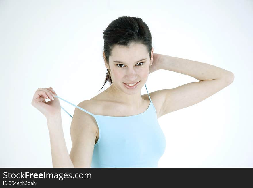 Young woman in blue looking happy. Young woman in blue looking happy