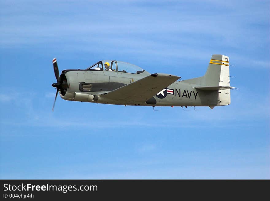 A T28 Trojan plane flies past during an airshow.