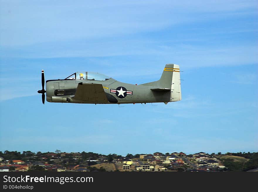 A T28 Trojan plane flies past during an airshow. A T28 Trojan plane flies past during an airshow.