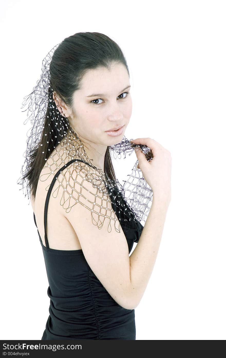 Pretty young brunette with a fresh, fit look, dressed in a short, light, black dress and playing with a net shawl over a white studio background, performs various postures and expressions. Pretty young brunette with a fresh, fit look, dressed in a short, light, black dress and playing with a net shawl over a white studio background, performs various postures and expressions