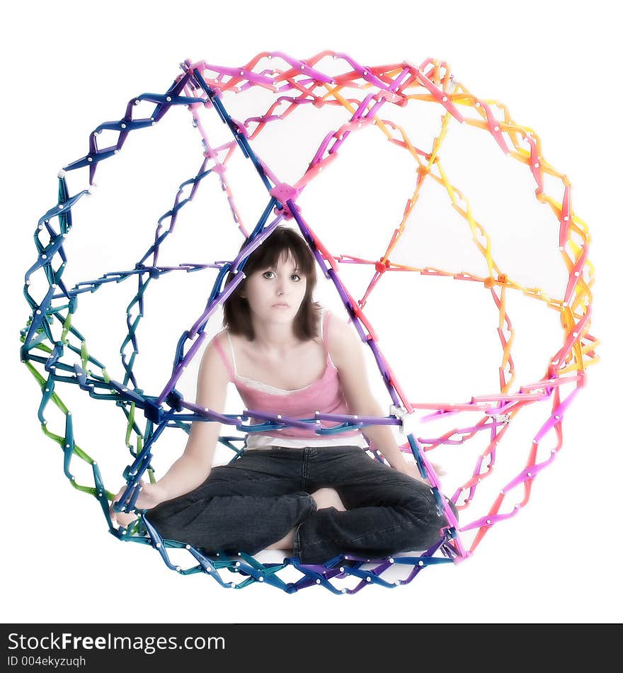 Beatiful teen girl inside collapsible rainbow colored ball.