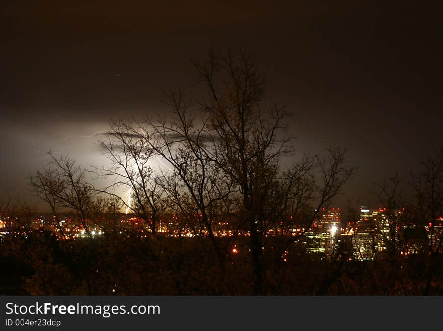 Lightening behind trees in Arlington. Lightening behind trees in Arlington