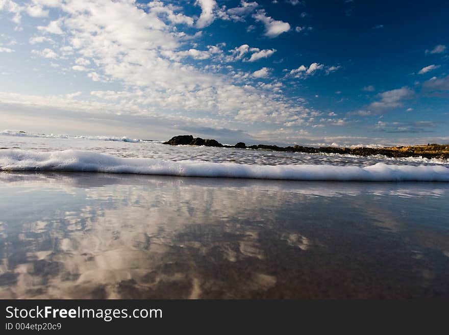 A low angle shot of a small wave