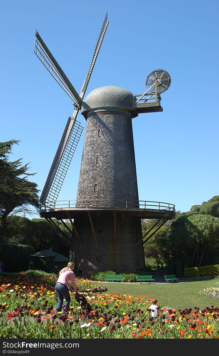 Windmill, flowers, mother and child.