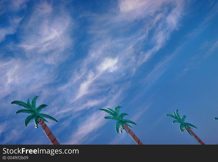 Fake palm trees with blue sky. Fake palm trees with blue sky.
