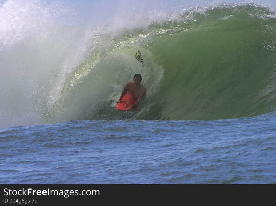 Bodyboarder Surfing a Tube