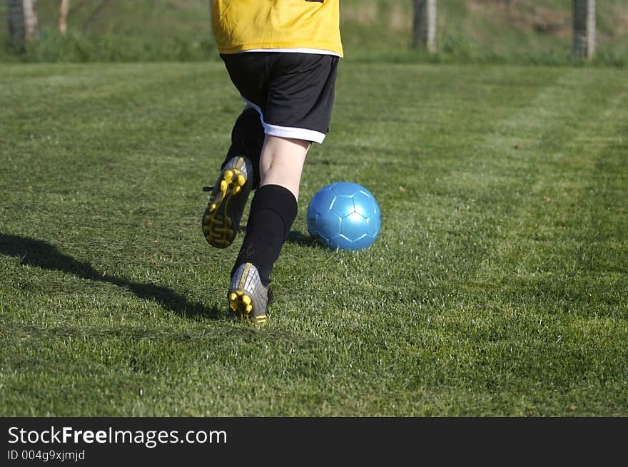 Young Boy Playing Youth Soccer