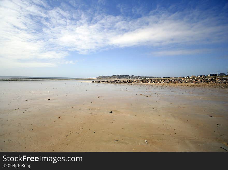 A large empty beach in carteret, normandy, france. A large empty beach in carteret, normandy, france