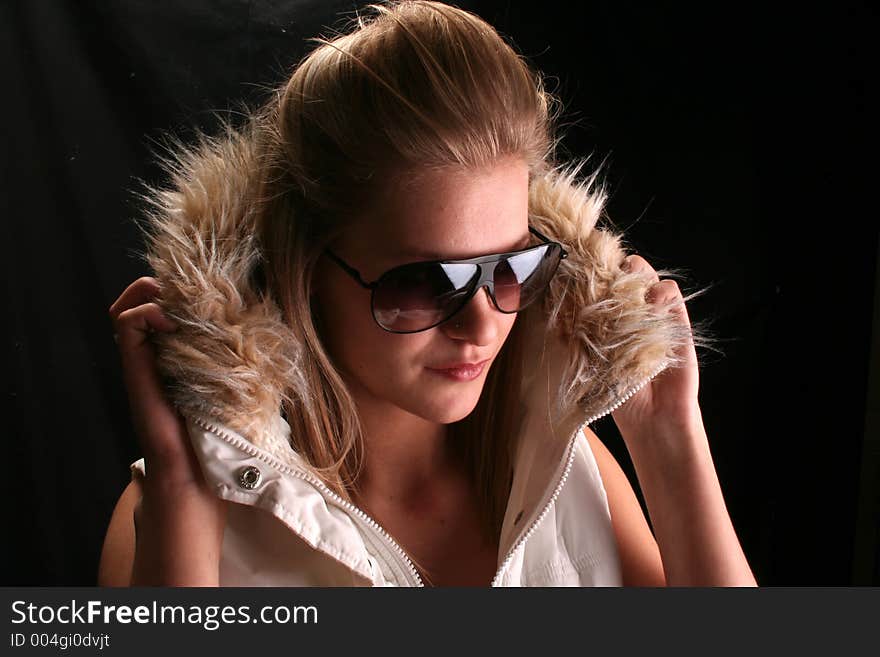 Model wearing a ski jacket and shades. Model wearing a ski jacket and shades