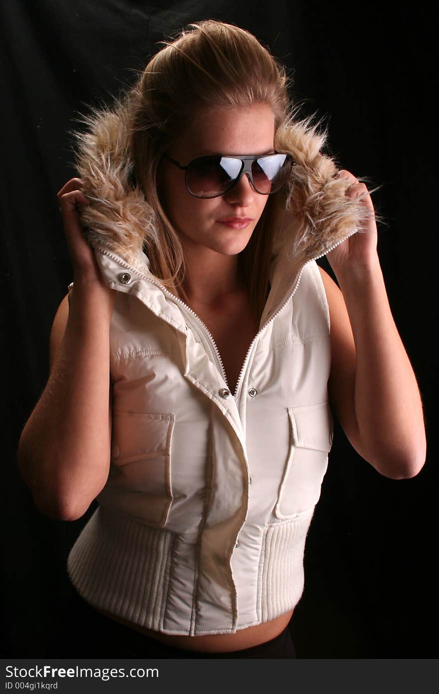 Model wearing a ski jacket and shades. Model wearing a ski jacket and shades