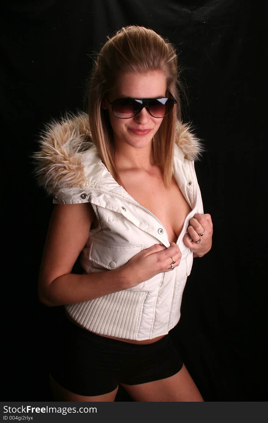 Model wearing a ski jacket and shades. Model wearing a ski jacket and shades