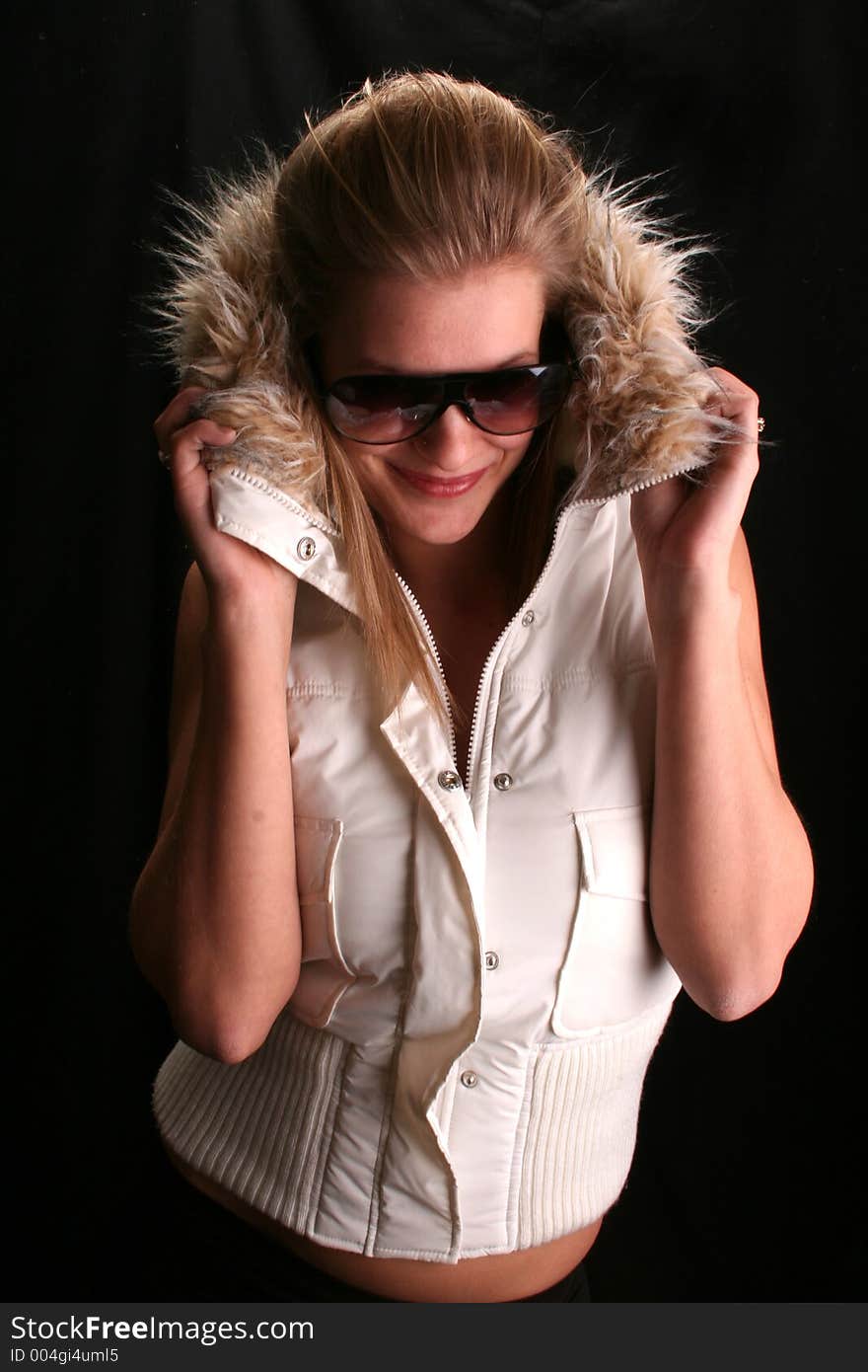 Model wearing shades and a winter jacket. Model wearing shades and a winter jacket