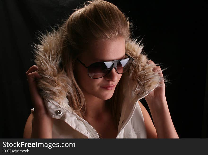 Model wearing winter jacket and shades. Model wearing winter jacket and shades