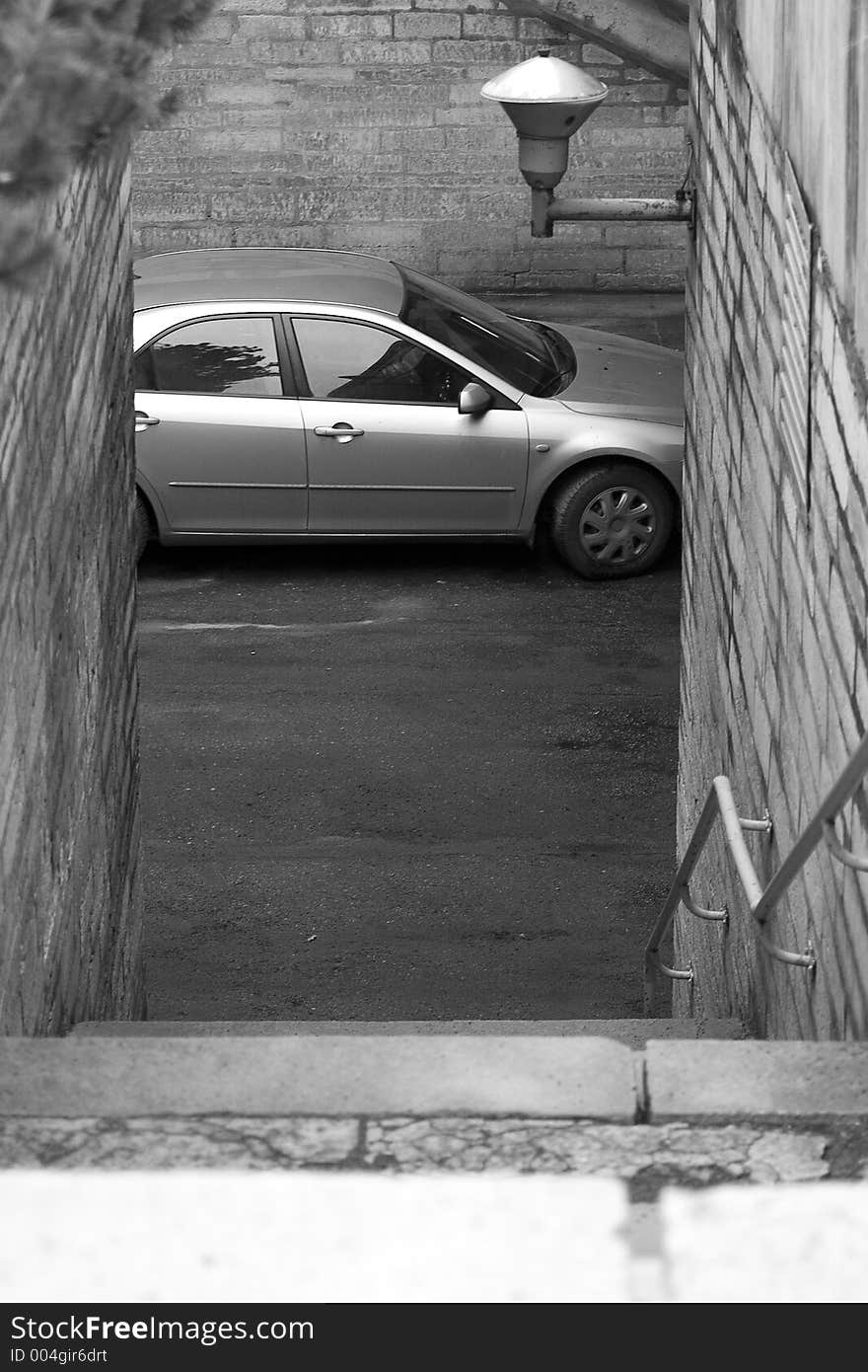 Car is waiting down by stairs. Car is waiting down by stairs