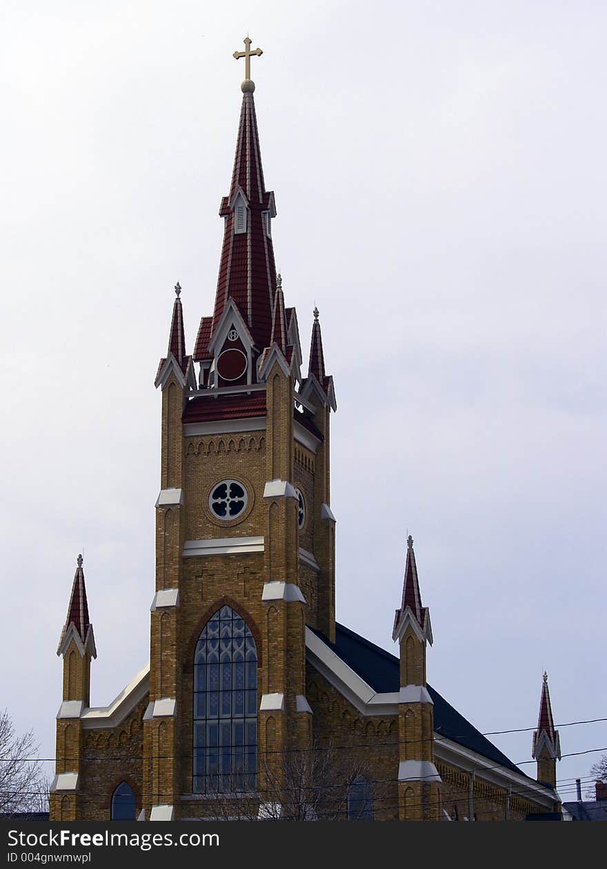 Small rural church with steeple tower and large stained glass window. Small rural church with steeple tower and large stained glass window