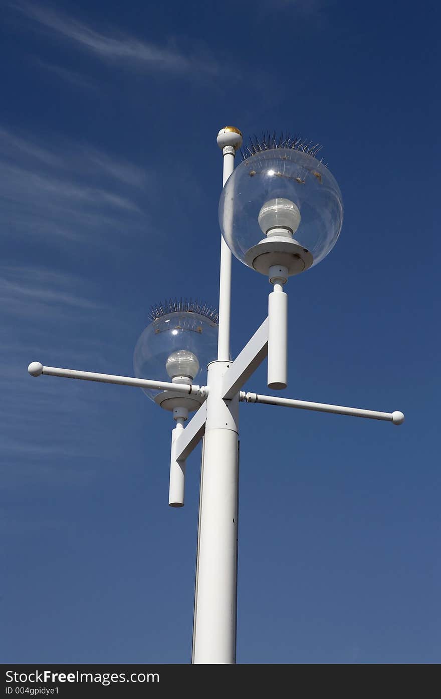 Street lights with spikes on the tops to stop birds roosting and pooing on them, the pier st Petersburg florida united states America usa taken in march 2006