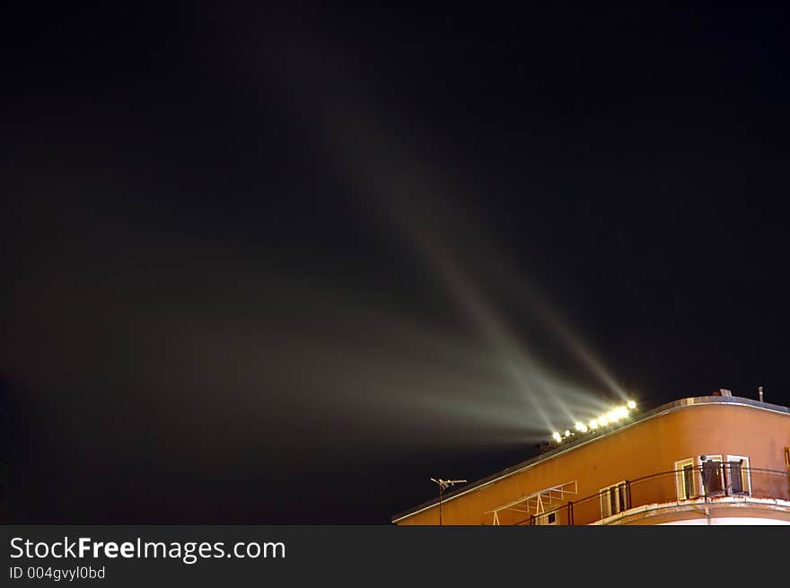 Spotlights pointed to the night sky. Spotlights pointed to the night sky