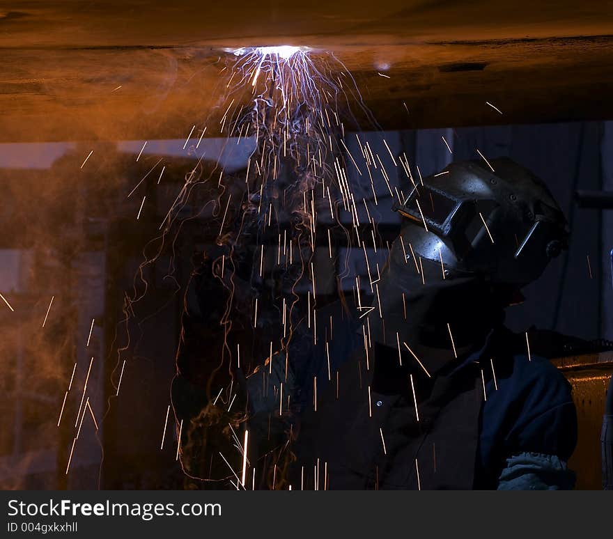 Welder making fire trails while welding