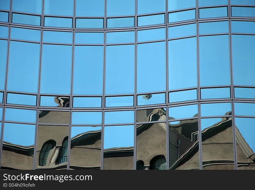 Reflections in a glass wall of a skyscraper