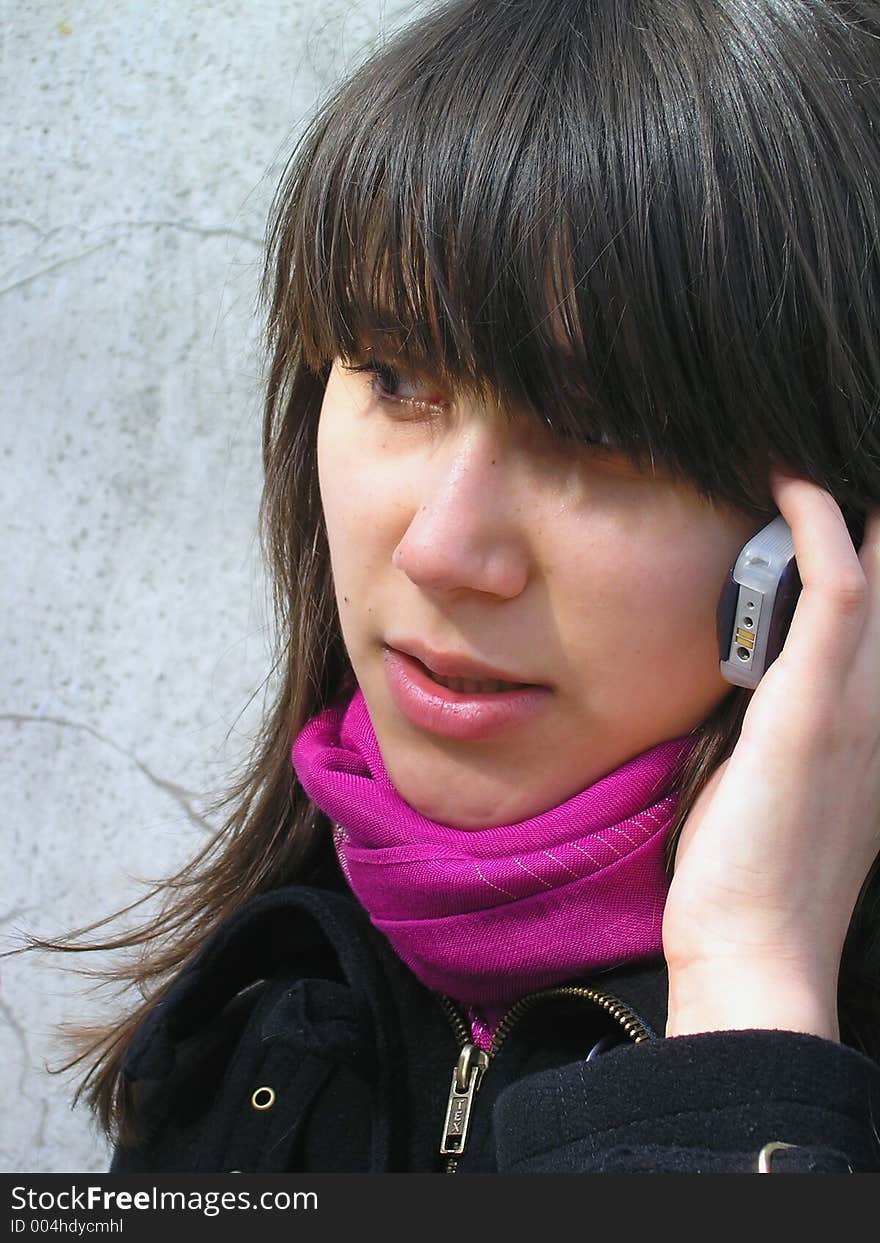 Girl talking with a phone. Girl talking with a phone