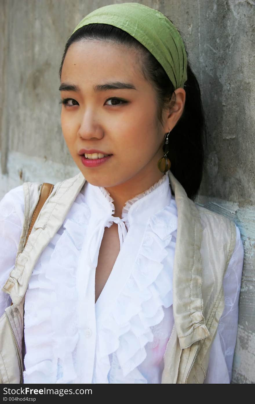 Beautiful Asian woman wearing a white shirt and denim skirt. Beautiful Asian woman wearing a white shirt and denim skirt