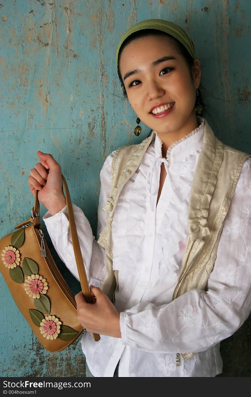 Asian woman holding a handbag