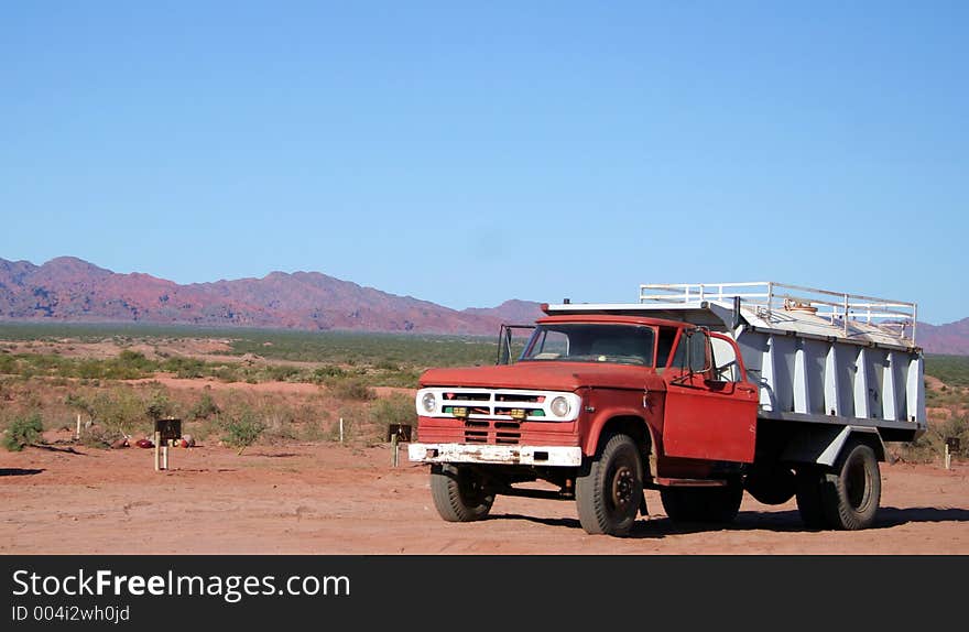 A red truck in the desert