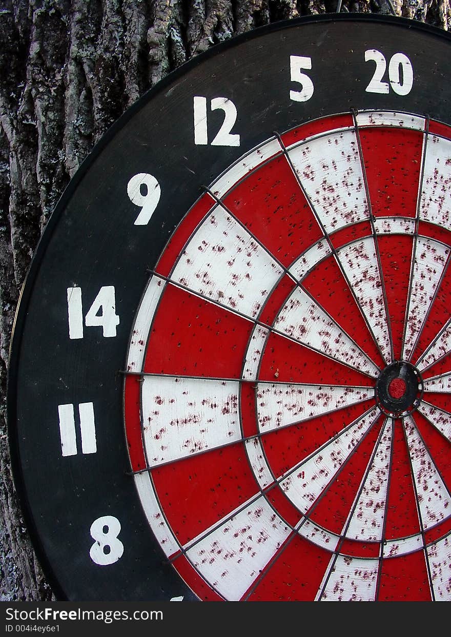 A well used dart board. A well used dart board