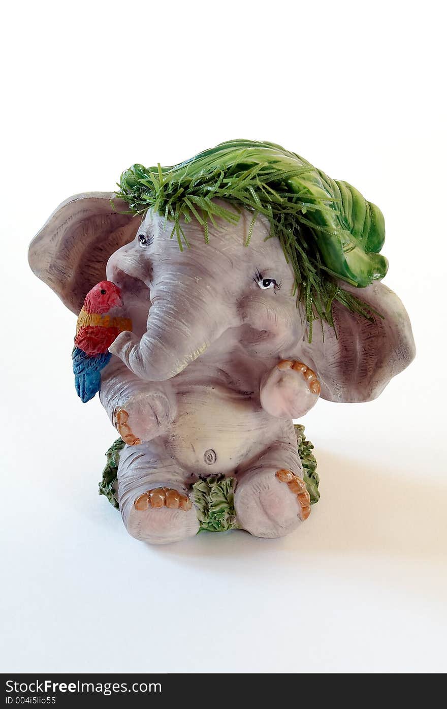 Toy elephant with parrot on white. Toy elephant with parrot on white