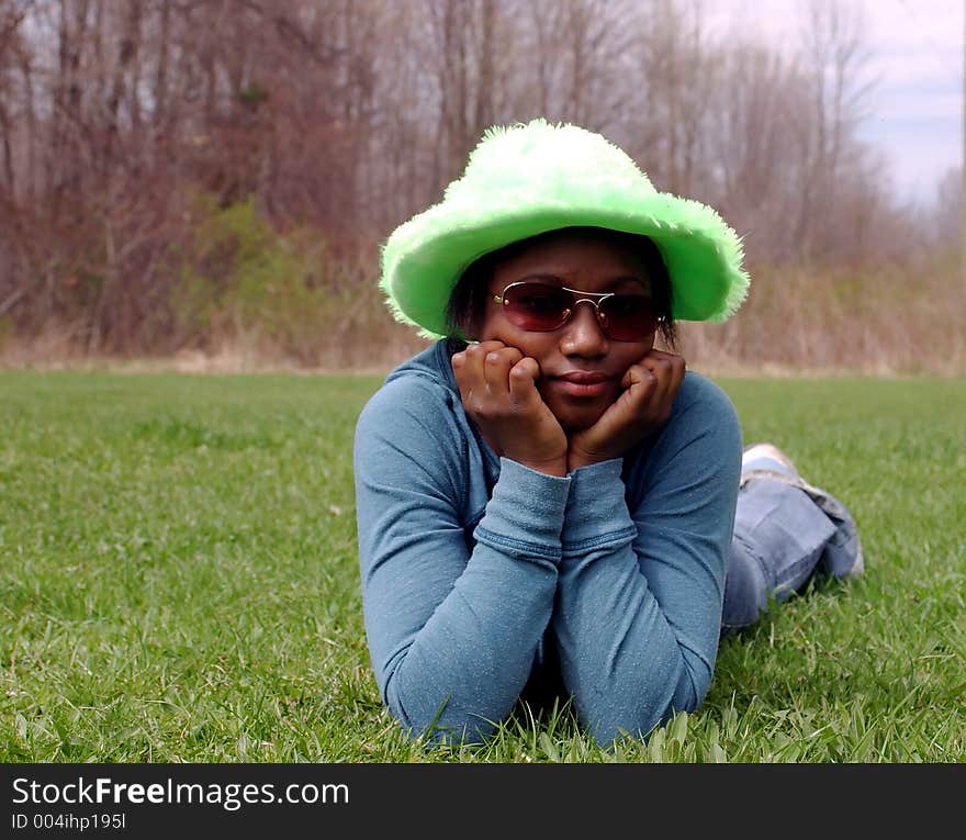 A teenage girl in a goofy hat. A teenage girl in a goofy hat.