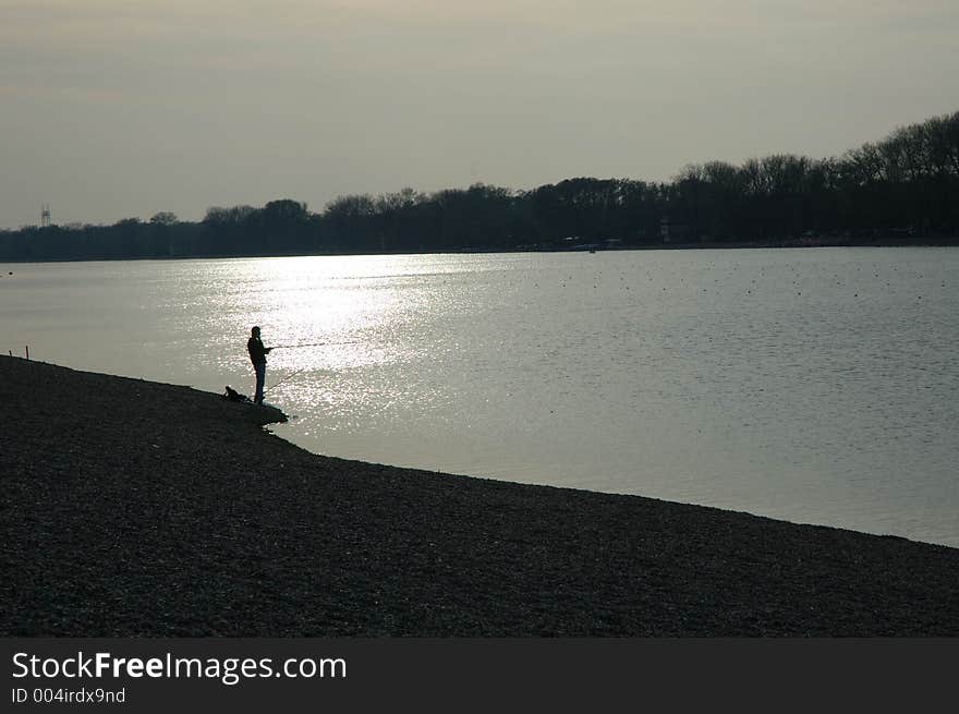 Fishing on sunset on lake