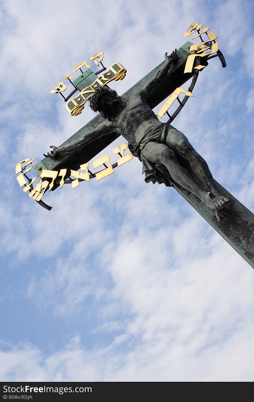 Backlit picture of crucified Christ against a cloudy sky. Backlit picture of crucified Christ against a cloudy sky.