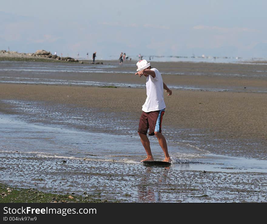 Young man beach surfing. Young man beach surfing