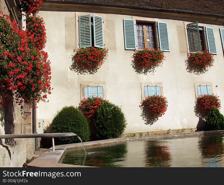 In the street of a alsacian villlage in the summer. In the street of a alsacian villlage in the summer