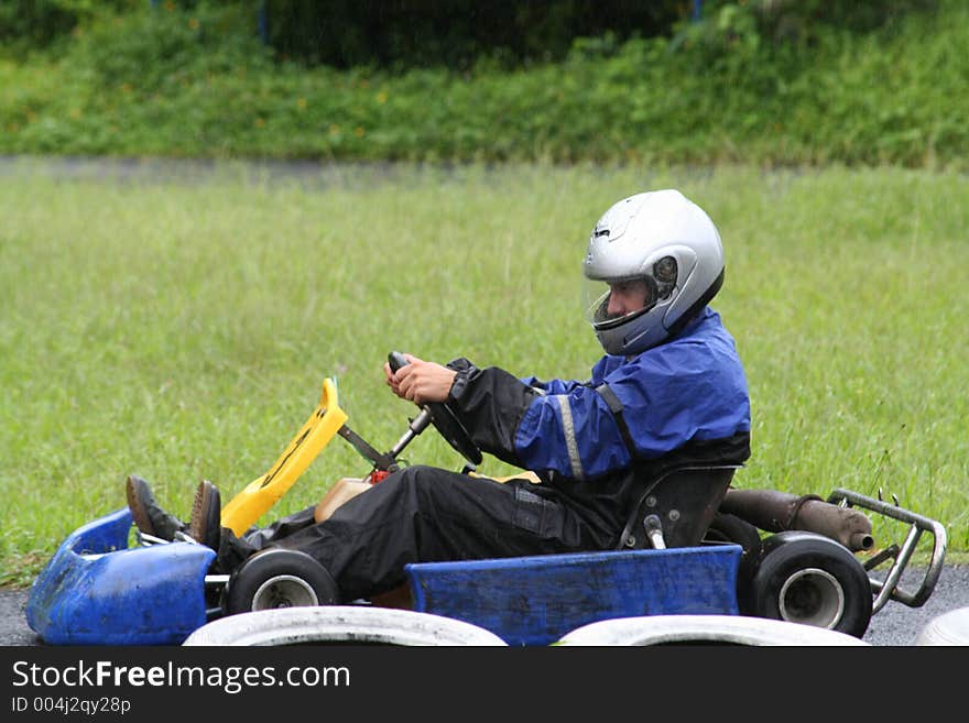 Karting in the rain, number 8,going left. Karting in the rain, number 8,going left