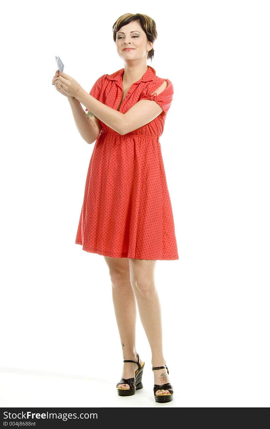 young actress with tattoos, a red girlish dress, poses different postures and expressions for an audition, with playing cards, over a white background. young actress with tattoos, a red girlish dress, poses different postures and expressions for an audition, with playing cards, over a white background