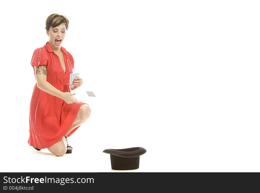 young actress with tattoos, a red girlish dress, poses different postures and expressions for an audition, with playing cards and a big black hat, over a white background. young actress with tattoos, a red girlish dress, poses different postures and expressions for an audition, with playing cards and a big black hat, over a white background