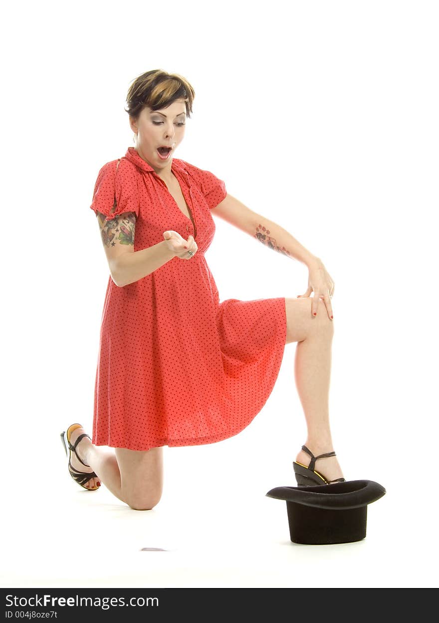 young actress with tattoos, a red girlish dress, poses different postures and expressions for an audition, with playing cards and a big black hat, over a white background. young actress with tattoos, a red girlish dress, poses different postures and expressions for an audition, with playing cards and a big black hat, over a white background