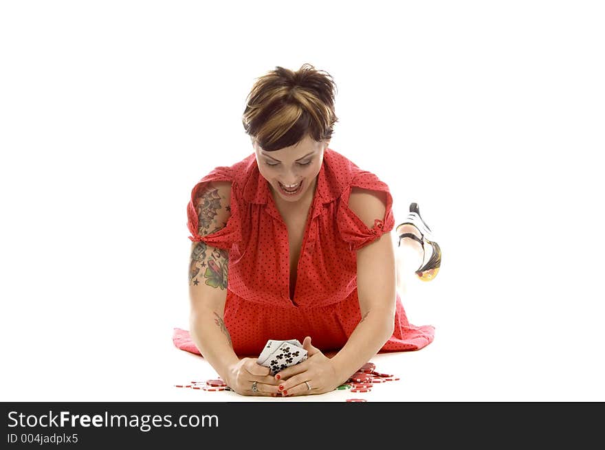 young actress with tattoos, a red girlish dress, poses different postures and expressions for an audition, holding some cards, laying on the white floor. young actress with tattoos, a red girlish dress, poses different postures and expressions for an audition, holding some cards, laying on the white floor