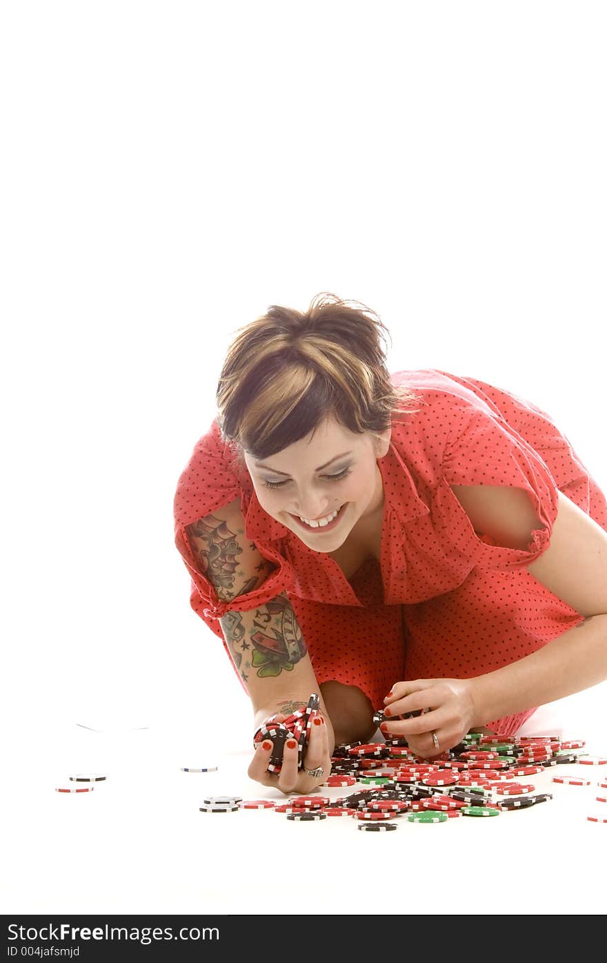 young actress with tattoos, a red girlish dress, poses different postures and expressions for an audition, with tokens in front of her, down on the white floor. young actress with tattoos, a red girlish dress, poses different postures and expressions for an audition, with tokens in front of her, down on the white floor