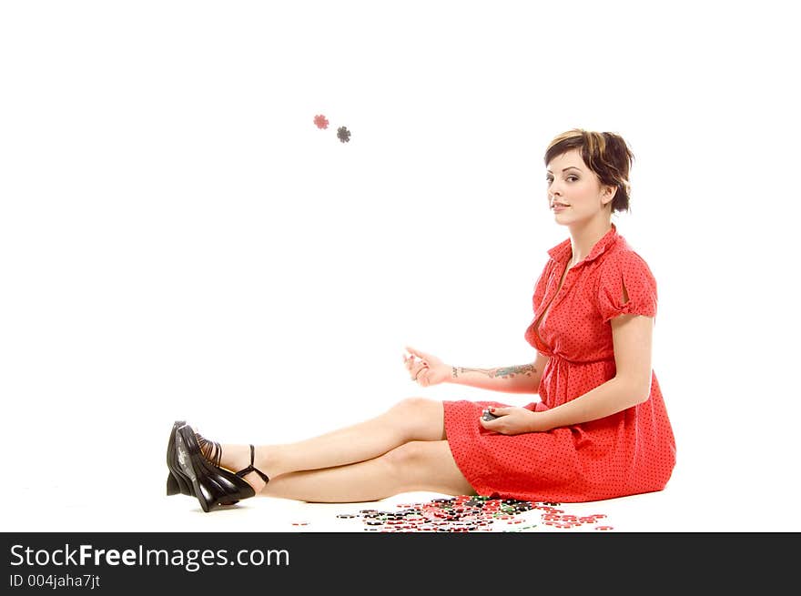 young actress with tattoos, a red girlish dress, poses different postures and expressions for an audition, throwing dices, over a white background. young actress with tattoos, a red girlish dress, poses different postures and expressions for an audition, throwing dices, over a white background